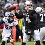 Derek Carr #4 of the Oakland Raiders looks to pass against the Denver Broncos during their NFL game at Oakland-Alameda County Coliseum on November 26, 2017 in Oakland, California.  (Photo by Robert Reiners/Getty Images)