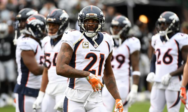 Aqib Talib #21 of the Denver Broncos walks off the field after being ejected for fighting with Mich...