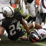 Marshawn Lynch #24 of the Oakland Raiders dives into the end zone for a touchdown against the Denver Broncos during their NFL game at Oakland-Alameda County Coliseum on November 26, 2017 in Oakland, California.  (Photo by Robert Reiners/Getty Images)