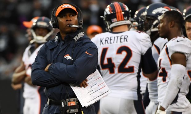 Head coach Vance Joseph of the Denver Broncos watches a replay during their NFL game against the Oa...