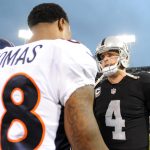 Demaryius Thomas #88 of the Denver Broncos speaks with Derek Carr #4 of the Oakland Raiders after the Raiders defeat of the Broncos 21-14 in their NFL game at Oakland-Alameda County Coliseum on November 26, 2017 in Oakland, California.  (Photo by Robert Reiners/Getty Images)
