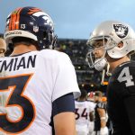 Trevor Siemian #13 of the Denver Broncos speaks with Derek Carr #4 of the Oakland Raiders after the Raiders defeat of the Broncos 21-14 in their NFL game at Oakland-Alameda County Coliseum on November 26, 2017 in Oakland, California.  (Photo by Robert Reiners/Getty Images)