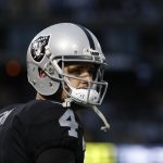Quarterback Derek Carr #4 of the Oakland Raiders is seen on the sideline during the fourth quarter of his NFL football game against the Denver Broncos at Oakland-Alameda County Coliseum on November 26, 2017 in Oakland, California. The Raiders defeated the Broncos 21-14. (Photo by Stephen Lam/Getty Images)
