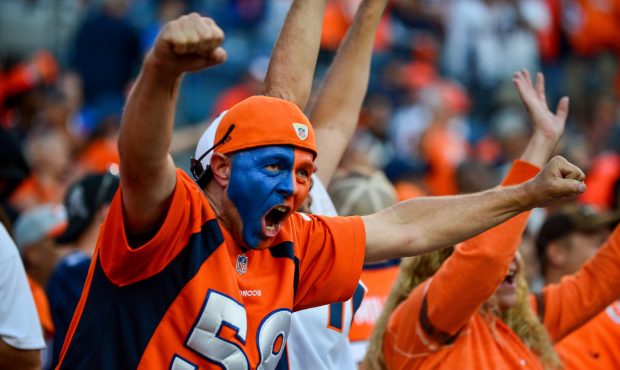 DENVER, CO - SEPTEMBER 17:  A Denver Broncos fan cheers in the fourth quarter of a game against the...