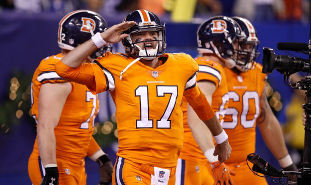 INDIANAPOLIS, IN - DECEMBER 14:  Brock Osweiler #17 of the Denver Broncos celebrates with teammates...