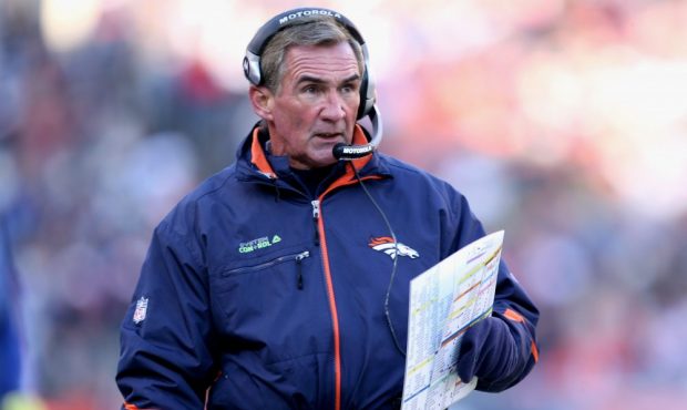 Head coach Mike Shanahan of the Denver Broncos leads his team against the Buffalo Bills at Invesco ...