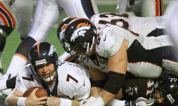 Denver Broncos Quarterback John Elway scores a touchdown in the fourth quarter of Super Bowl XXXIII...
