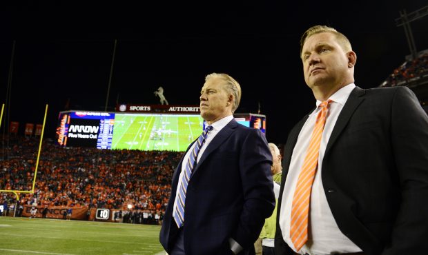 John Elway and Matt Russell watch the final seconds during the fourth quarter on Monday, October 24...