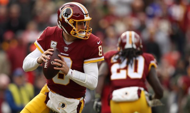 LANDOVER, MD - NOVEMBER 12: Quarterback Kirk Cousins #8 of the Washington Redskins looks to pass ag...
