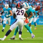 Bradley Roby #29 of the Denver Broncos forces a fumble during the third quarter against the Miami Dolphins at the Hard Rock Stadium on December 3, 2017 in Miami Gardens, Florida.  (Photo by Chris Trotman/Getty Images)