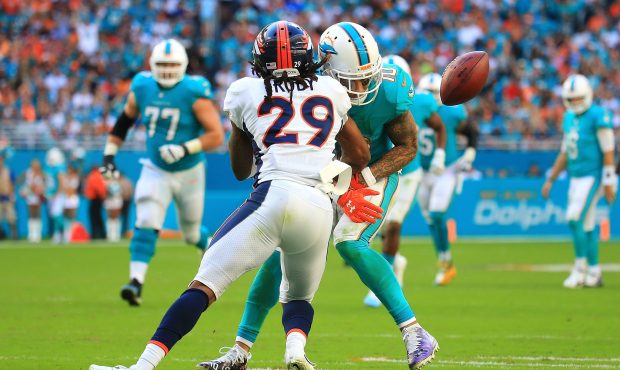 Bradley Roby #29 of the Denver Broncos forces a fumble during the third quarter against the Miami D...