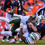 Quarterback Trevor Siemian #13 of the Denver Broncos is sacked by Demario Davis #56 and outside linebacker David Bass #47 of the New York Jets at Sports Authority Field at Mile High on December 10, 2017 in Denver, Colorado. (Photo by Dustin Bradford/Getty Images)