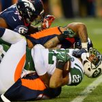 Running back Matt Forte #22 of the New York Jets is tackled for a loss by a trio of Denver Broncos defensive players in the fourth quarter of a game at Sports Authority Field at Mile High on December 10, 2017 in Denver, Colorado. (Photo by Dustin Bradford/Getty Images)
