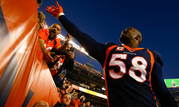 Outside linebacker Von Miller #58 of the Denver Broncos celebrates with the fans after a 23-0 victo...