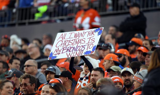 Denver Broncos fan holds up her sign during the game against the New York Jets on December 10, 2017...