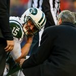 Quarterback Josh McCown #15 of the New York Jets begins to remove his helmet after appearing to sustain an injury in the third quarter of a game against the Denver Broncos at Sports Authority Field at Mile High on December 10, 2017 in Denver, Colorado. McCown would not return to the game. (Photo by Dustin Bradford/Getty Images)
