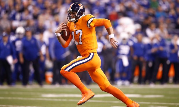 INDIANAPOLIS, IN - DECEMBER 14:  Brock Osweiler #17 of the Denver Broncos runs for a touchdown agai...
