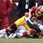 Quarterback Kirk Cousins #8 of the Washington Redskins is tackled by outside linebacker Shaquil Barrett #48 of the Denver Broncos in the second quarter at FedExField on December 24, 2017 in Landover, Maryland. (Photo by Rob Carr/Getty Images)
