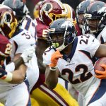 Running back C.J. Anderson #22 of the Denver Broncos carries the ball against the Washington Redskins in the second quarter at FedExField on December 24, 2017 in Landover, Maryland. (Photo by Patrick McDermott/Getty Images)