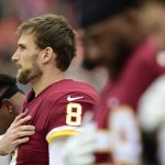 Quarterback Kirk Cousins #8 of the Washington Redskins listens to the National Anthem before a game against the Denver Broncos at FedExField on December 24, 2017 in Landover, Maryland. (Photo by Patrick McDermott/Getty Images)