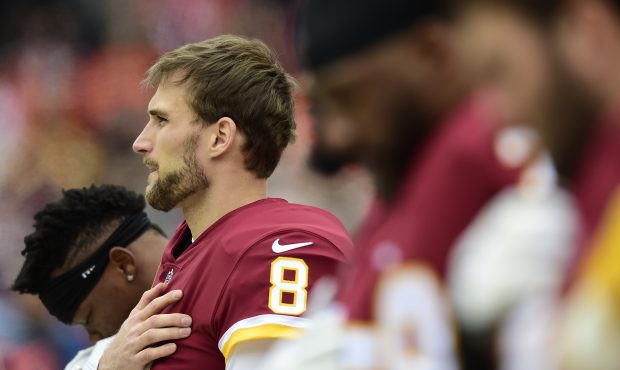 Quarterback Kirk Cousins #8 of the Washington Redskins listens to the National Anthem before a game...