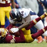 Free safety D.J. Swearinger #36 of the Washington Redskins is tackled by tight end Austin Traylor #86 of the Denver Broncos after intercepting a pass thrown by quarterback Brock Osweiler #17 (not pictured) in the second quarter at FedExField on December 24, 2017 in Landover, Maryland. (Photo by Patrick McDermott/Getty Images)