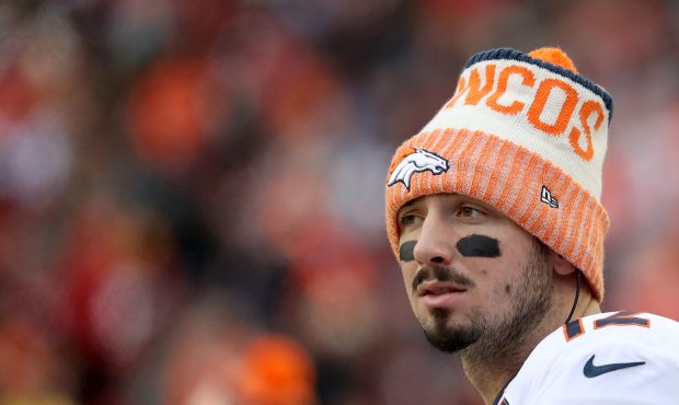 Quarterback Paxton Lynch #12 of the Denver Broncos looks on from the sidelines in the second half a...