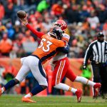 Quarterback Patrick Mahomes #15 of the Kansas City Chiefs is hit by linebacker Deiontrez Mount #53 of the Denver Broncos as he attempts a pass int he first quarter of a game at Sports Authority Field at Mile High on December 31, 2017 in Denver, Colorado. (Photo by Dustin Bradford/Getty Images)