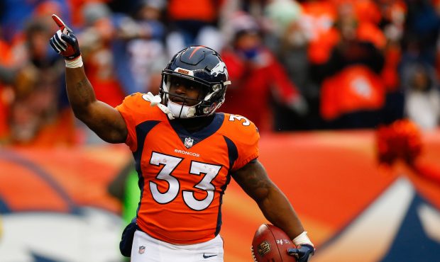 Running back De'Angelo Henderson #33 of the Denver Broncos celebrates his first-quarter touchdown a...