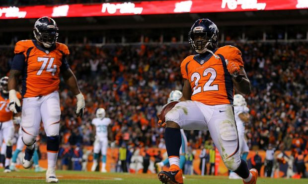 Running back CJ Anderson #22 of the Denver Broncos celebrates a fourth quarter touchdown against th...