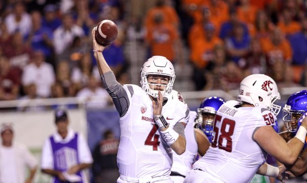 Quarterback Luke Falk #4 of the Washington State Cougars passing during first half action against t...