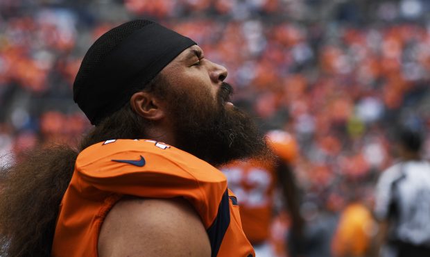 Domata Peko (94) of the Denver Broncos takes a moment before the first quarter on Sunday, September...