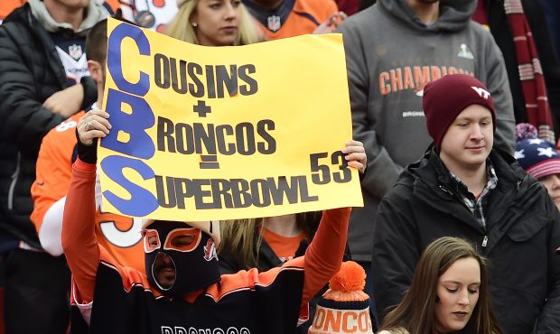 A Denver Broncos fan holds a sign for quarterback Kirk Cousins #8 of the Washington Redskins (not p...