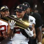 Minkah Fitzpatrick #29 of the Alabama Crimson Tide holds the trophy while celebrating with his team after defeating the Georgia Bulldogs in overtime to win the CFP National Championship presented by AT&T at Mercedes-Benz Stadium on January 8, 2018 in Atlanta, Georgia. Alabama won 26-23.  (Photo by Mike Ehrmann/Getty Images)