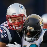 Rob Gronkowski #87 of the New England Patriots is hit by Barry Church #42 of the Jacksonville Jaguars in the second quarter during the AFC Championship Game at Gillette Stadium on January 21, 2018 in Foxborough, Massachusetts.  (Photo by Kevin C. Cox/Getty Images)