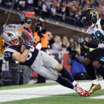 Danny Amendola #80 of the New England Patriots catches a touchdown pass as he is defended by Tashaun Gipson #39 of the Jacksonville Jaguars in the fourth quarter during the AFC Championship Game at Gillette Stadium on January 21, 2018 in Foxborough, Massachusetts.  (Photo by Elsa/Getty Images)