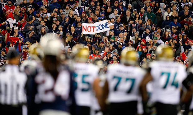 Fans display a sign during the AFC Championship Game between the New England Patriots and the Jacks...