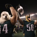 Beau Allen #94 and Chris Long #56 of the Philadelphia Eagles celebrates their teams win while wearing a dog masks over the Minnesota Vikings in the NFC Championship game at Lincoln Financial Field on January 21, 2018 in Philadelphia, Pennsylvania.  (Photo by Patrick Smith/Getty Images)