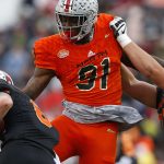 Kurt Benkert #6 of the South team is sacked by Jalyn Holmes #91 of the North team during the first half of the Reese's Senior Bowl at Ladd-Peebles Stadium on January 27, 2018 in Mobile, Alabama.  (Photo by Jonathan Bachman/Getty Images)