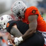 Kurt Benkert #6 of the South team is sacked by Jalyn Holmes #91 of the North team during the first half of the Reese's Senior Bowl at Ladd-Peebles Stadium on January 27, 2018 in Mobile, Alabama.  (Photo by Jonathan Bachman/Getty Images)
