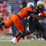 Jordan Akins #88 of the South team is tackled by Dewey Jarvis #94 of the North team during the second half of the Reese's Senior Bowl at Ladd-Peebles Stadium on January 27, 2018 in Mobile, Alabama.  (Photo by Jonathan Bachman/Getty Images)