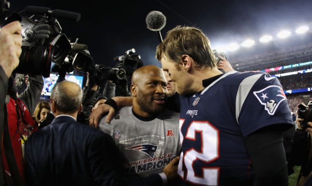 FOXBOROUGH, MA - JANUARY 21:  Tom Brady #12 of the New England Patriots celebrates with James Harri...