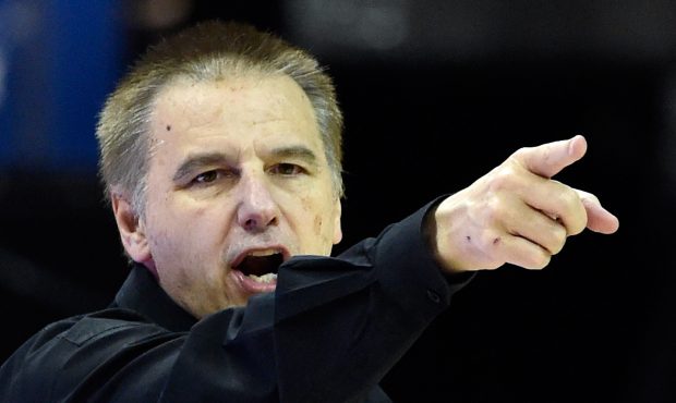 Head Coach Larry Eustachy of the Colorado State Rams calls to his team during a semifinal game of t...