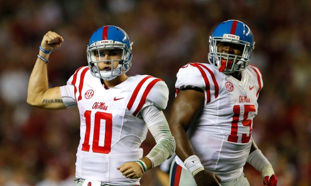 Chad Kelly #10 of the Mississippi Rebels reacts after passing for a touchdown against the Alabama C...
