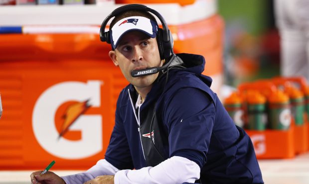 New England Patriots offensive coordinator Josh McDaniels looks on during the second half against t...
