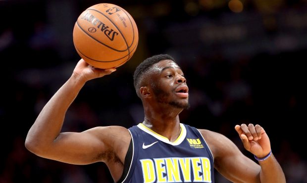 Emmanuel Mudiay #0 of the Denver Nuggets looks for an outlet pass against the Miami Heat at the Pep...