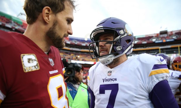 Quarterback Kirk Cousins #8 of the Washington Redskins talks with quarterback Sam Bradford #8 of th...