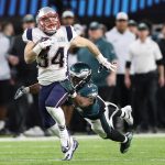 MINNEAPOLIS, MN - FEBRUARY 04:  Rex Burkhead #34 of the New England Patriots breaks a tackle from Corey Graham #24 of the Philadelphia Eagles during the second quarter in Super Bowl LII at U.S. Bank Stadium on February 4, 2018 in Minneapolis, Minnesota.  (Photo by Patrick Smith/Getty Images)