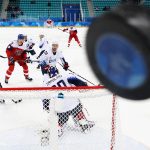 Players watch as the puck hits the glass in the first period of the Men's Play-offs Quarterfinals between the Czech Republic and the United States on day twelve of the PyeongChang 2018 Winter Olympic Games at Gangneung Hockey Centre on February 21, 2018 in Gangneung, South Korea.  (Photo by Ronald Martinez/Getty Images)