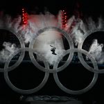 A snowboarder jumps through the Olympic rings to kick off the Opening Ceremony of the 2010 Vancouver Winter Olympics at BC Place on February 12, 2010 in Vancouver, Canada.  (Photo by Bruce Bennett/Getty Images)